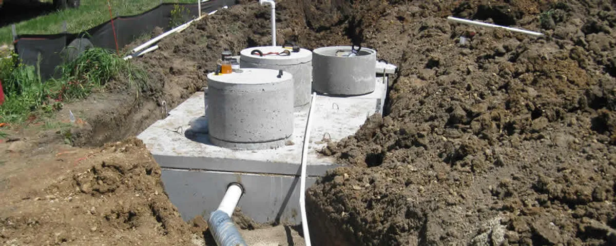 Septic system repair and installation site with tank access ports in Marietta, GA